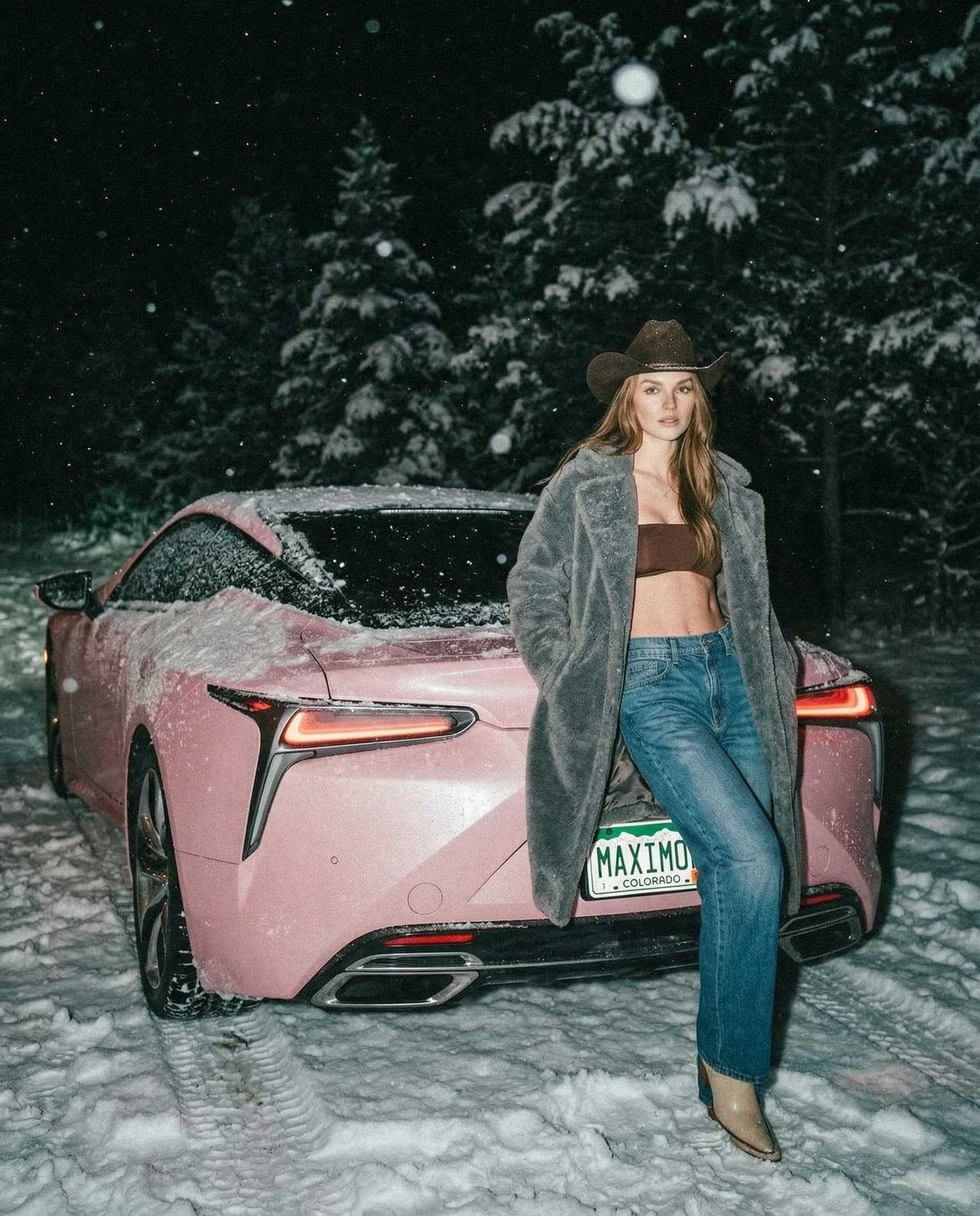 move her to the rear view of the Lexus LC 500. the license plate is for Colorado saying "MAXIMOK". she partially blocking it.